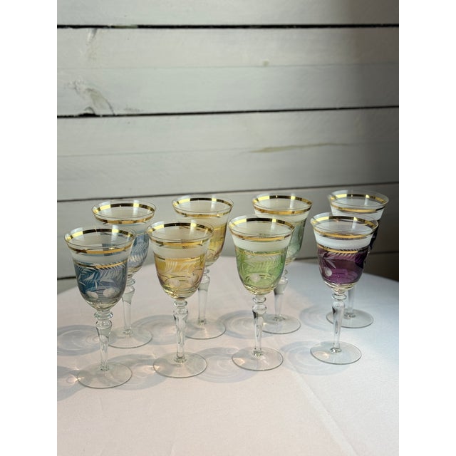 Add a splash of color and vintage charm to your table with this stunning set of Midcentury Colored Cut Glass Wine Goblets....