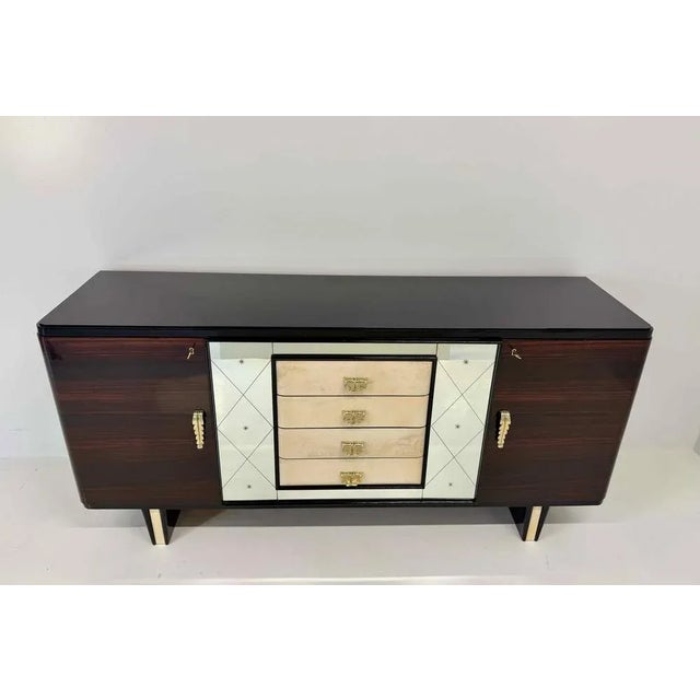 Refined Art Deco sideboard produced in Italy in the 1940s, attributed to Osvaldo Borsani. The structure is in fine...
