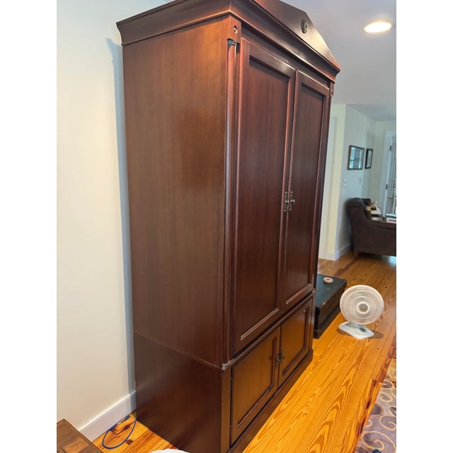 This lovely, cherry Ethan Allen Entertainment Center is a great way to store your TV and associated electronics. The...