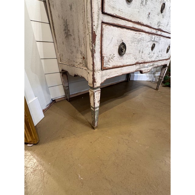 This piece is an Antique Italian Painted Chest of Drawers, also commonly referred to as a commode. This chest showcases...