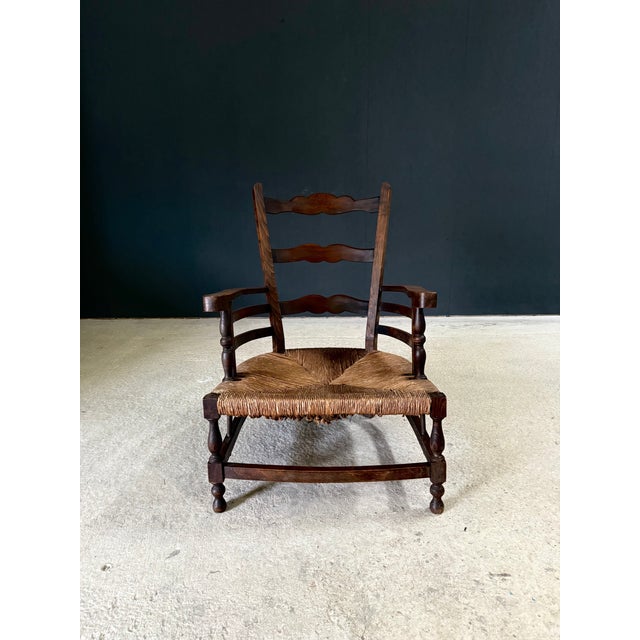 Vintage Early 1900's French Provincial Rural Design Low Lounge Chair. Made in France, 1900's period. Oak wood turned and...