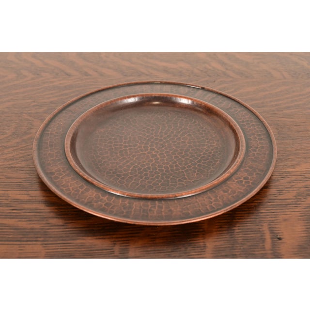 A gorgeous Arts & Crafts period hand hammered copper charger plate or tray By Roycroft (signed with impressed orb and...