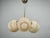 Elegant Art Deco chandelier manufactured in Czechoslovakia during the 1930s, featuring a sophisticated composition of...