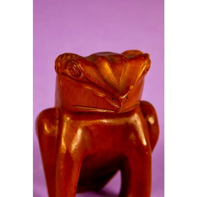Hand carved mid century wooden frog sculpture. 1950's vintage with great detail and in very nice condition save for a few...