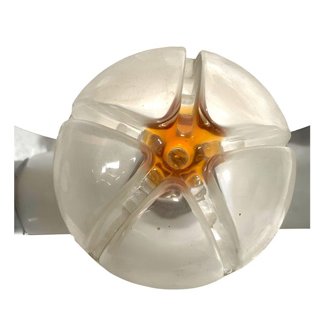 Mid-century era chrome space-age wall sconce featuring an Italian Murano art glass shade by A.V. Mazzega. The globe is...