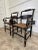 A pair of antique (reproduced) Hitchcock arm chairs with wicker seating. Beautifully painted and carved detailing. You can...