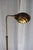 A beautifully sculptural vintage brass floor lamp in the style of Frederick Cooper, featuring the signature clamshell...