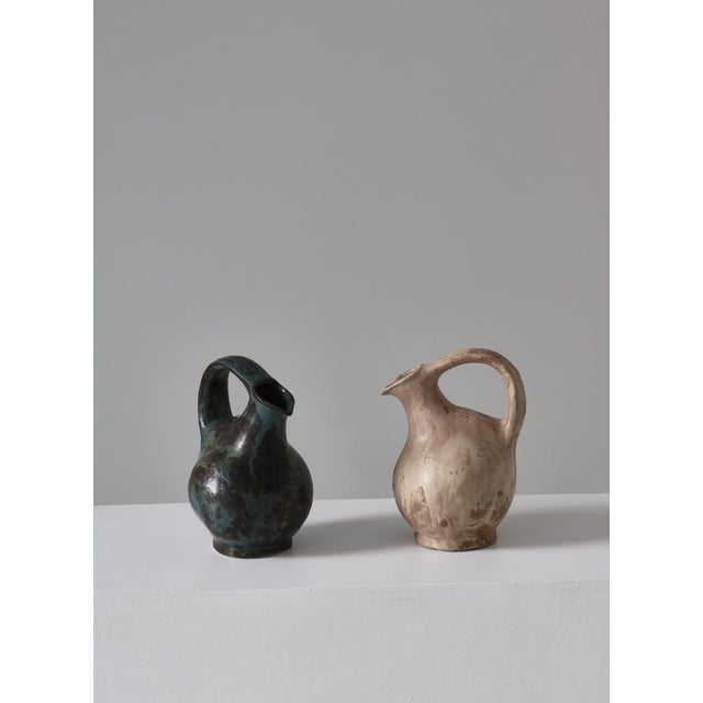 Amazing and unique early stoneware pitchers by Danish ceramic artist Bode Willumsen. Both were made at his own studio in...