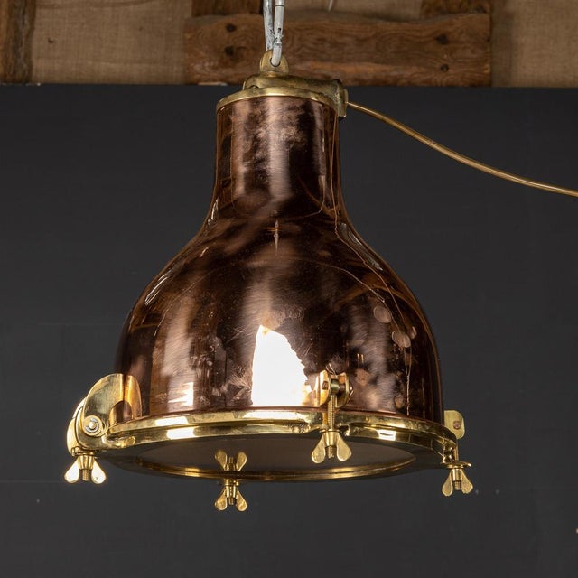 A fabulous polished brass light that once belonged to a Danish ship that circumnavigated the globe delivering cargo goods....
