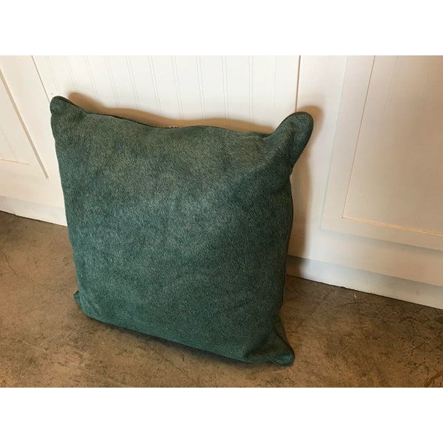 Beautiful cowhide pillow with leather piping. Zippered back with insert included.