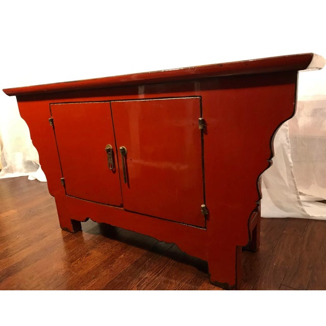 Lovely vintage deep orange red cinnabar rustic lacquered Chinese alter cabinet, sideboard, buffet. This piece is small...