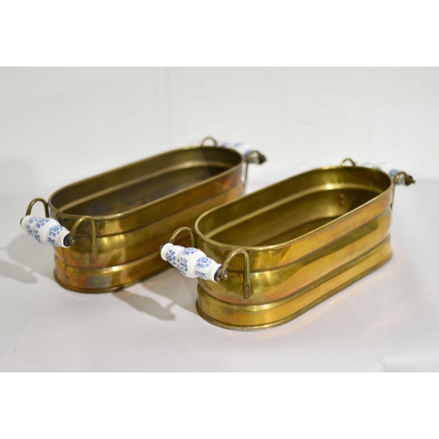 A small detail that makes a big impact. This pair of vintage brass herb planters is finished with classic blue and white...