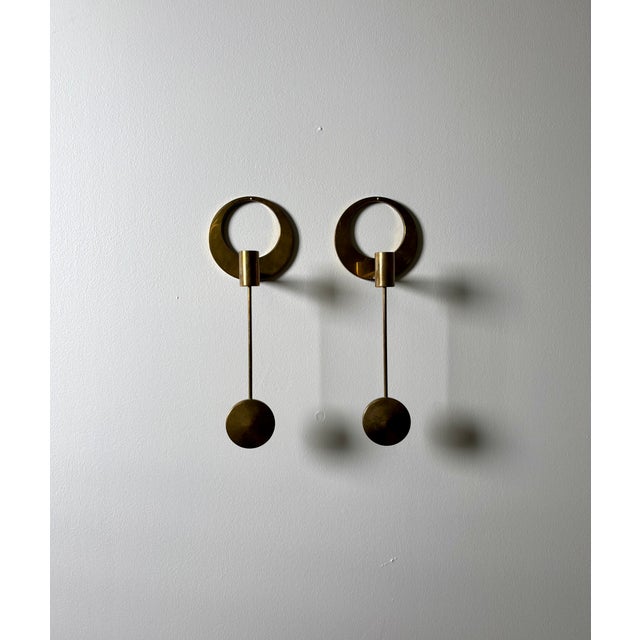 Wall-hung candlesticks in brass produced in Sweden, 1960s. For candles with diameter 13 mm. This piece has an attribution...