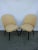 This pair of chairs from the 1960s is made from wood and vinyl and remain in an original condition.