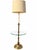 Elegant vintage brass floor lamp featuring a sculptural pedestal base with ornate floral detailing, accented by a circular...