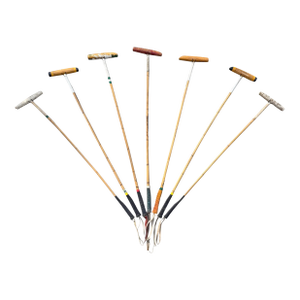 Collection of Seven Vintage Polo Sticks on Custom Wall Mounts