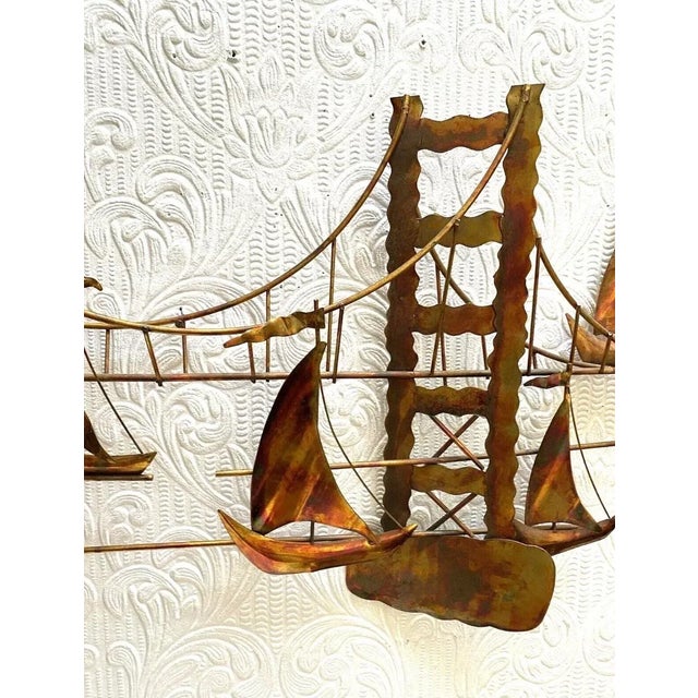 Vintage Mid Century Modern Metal Golden Gate Bridge Boats Wall Hanging in the style of Jere, but not signed. It measures...