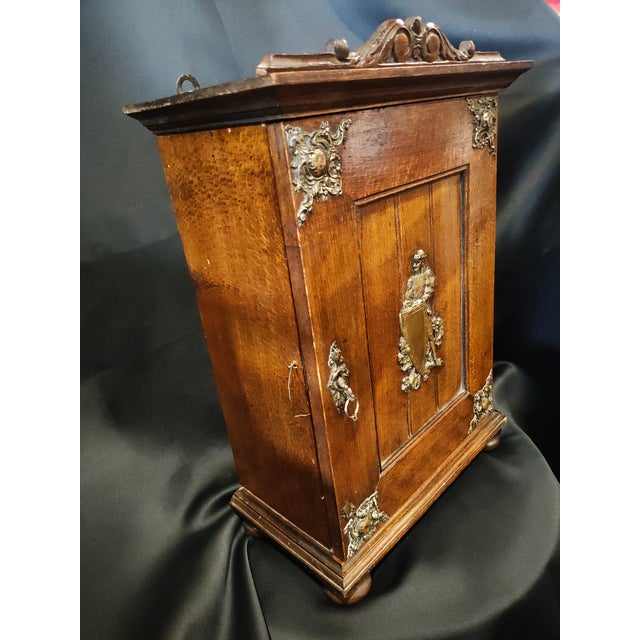 charming and highly decorative late 19th-century French wall cabinet originally crafted as a case for a traditional...