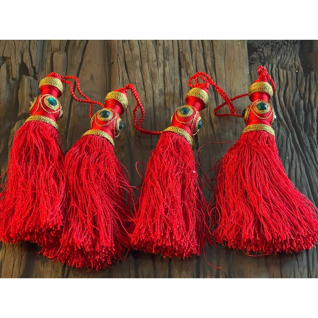Gorgeous bright red with gold silk tassels decorated with dark blue glass eyes.
