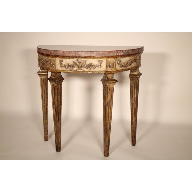 Antique Louis XVI style painted and silver leaf console table with marble top, 19th century. With a 20th /21st century...