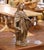 This refined antique bronze sculpture depicts the Virgin Mary in a serene, open-armed pose, symbolizing grace, compassion,...