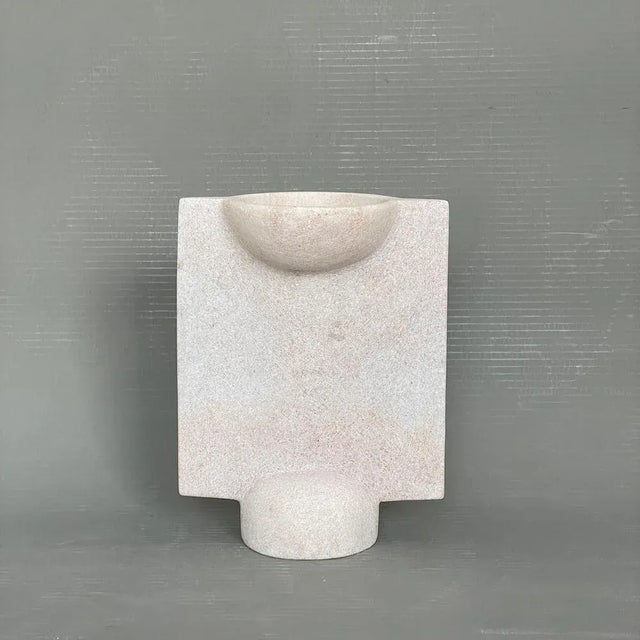 Hand carved marble vessel by tom von kaenel materials: marble dimensions: w12.5 x d20 x h26 cm this piece is attributed to...