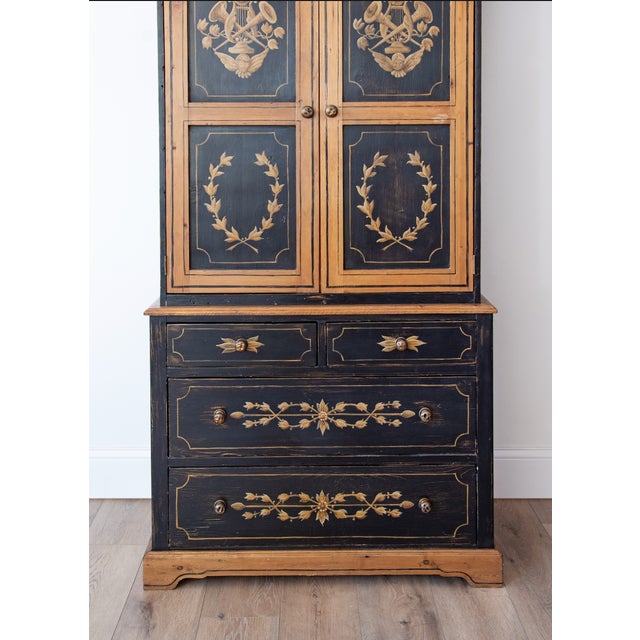 A beautifully proportioned Scandinavian painted pine linen press, handcrafted in the Gustavian tradition with richly...