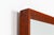 A beautiful and elegant rectangular wall mirror made in Denmark during the 1960s. The mirror features a slender solid teak...