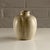 Pale stone, matte-glazed Model 148 vase by Arne Bang, Denmark, 1930s. Incised AB signature on the base. Incised marks are...