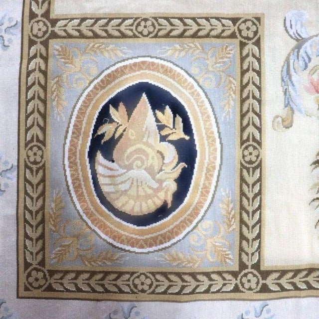 An exquisite oversized antique French Aubusson tapestry, dating from approximately 1930. This textile piece showcases a...