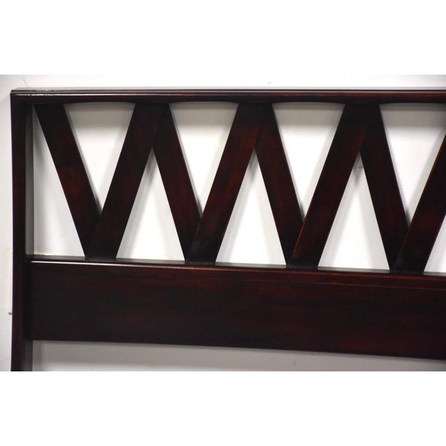 A mid century modern full size headboard designed by Paul Frankl for Johnson Furniture in a dark mahogany or ebony finish....