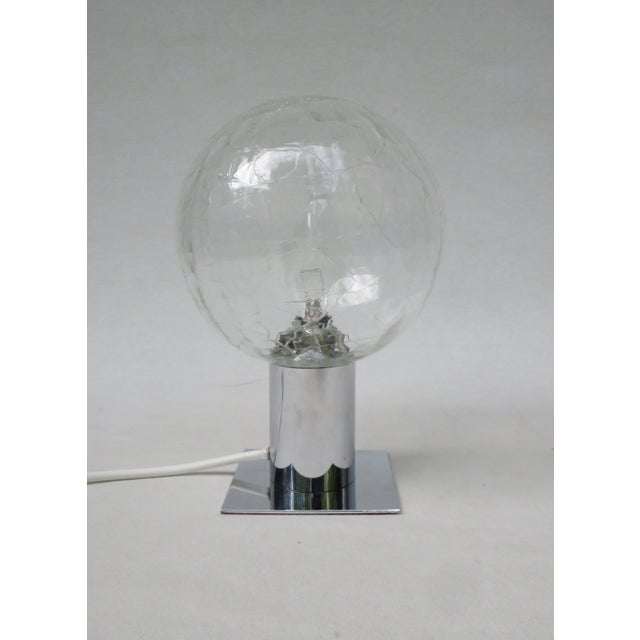 Exceptional pair of small table lamps, space age era, 70s. The small table lamps pair is dimensionally reduced. It has...