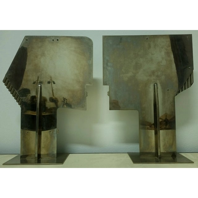 Large pair of Modernist sculptures depicting two stylized human profiles, male and female, facing each other, Austria,...
