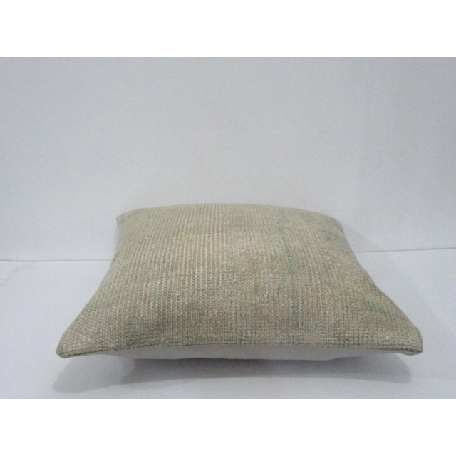 Decorative pillow cover made from a vintage Turkish handknotted rug. Backed with good quality cotton fabric. Pillow...