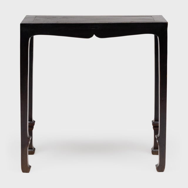 Simple yet refined, this lacquered Chinese console table is an elegant addition to an entry, hallway or alcove. The...