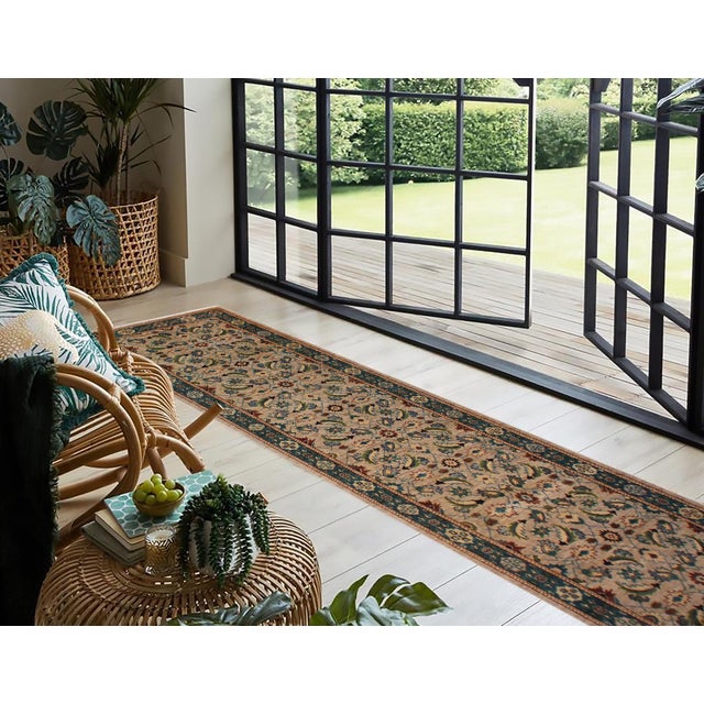 Enhance the ambiance of your home with this magnificent Persian-influenced Turkish hand-knotted rug made by skilled...