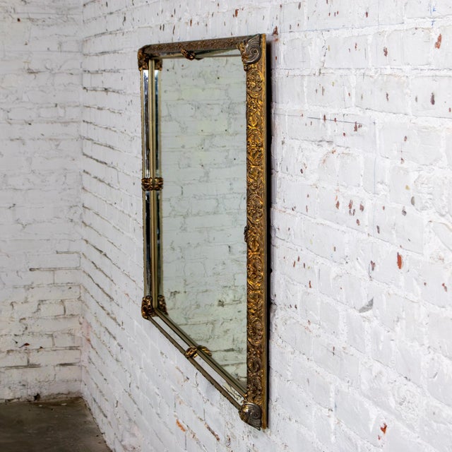 Marvelous vintage Neoclassic to Rococo rectangular large wall mirror with ornate gilded frame featuring a distressed...