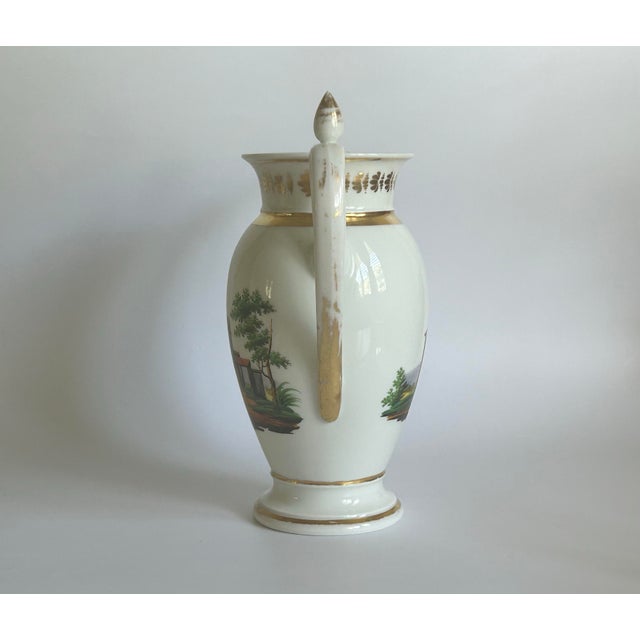 A beautiful French hard-paste porcelain coffee pot dating to circa 1820–1830, from the Restoration period. The elegant...
