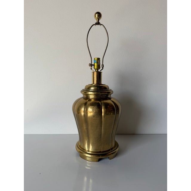 Elegant vintage table lamp designed in the style of Frederick Cooper, featuring a classic urn-shaped body crafted from...