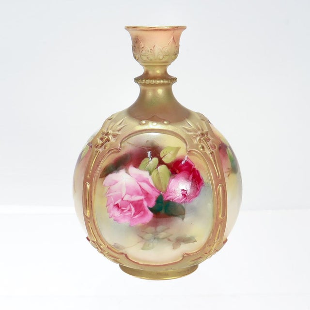 A fine antique porcelain flower vase. By Royal Worcester. Model no. F126/H. Designed by James Hadley. Of a bulbous form...