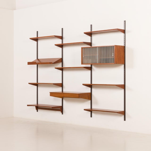 An extremely elegant teak shelving unit, designed by kai kristiansen and manufactured in denmark in the 1960s by fm...