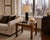 An elegant vintage burl wood waterfall side table featuring rich figured veneer, clean lines, and subtle brass inlay...