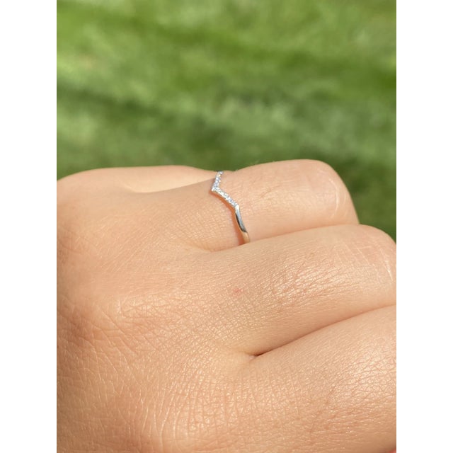 The Tara Road: Petite Angular Natural Diamond Band. The band features a cleft of diamonds with an approximate total weight...