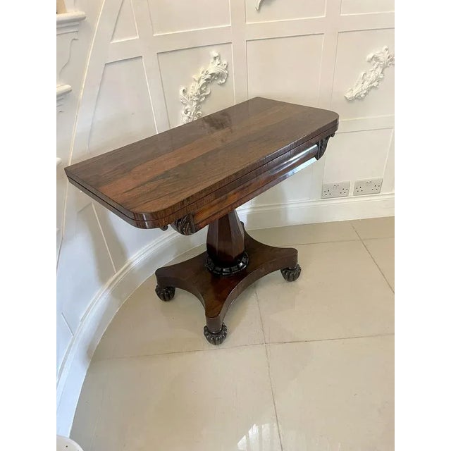 Antique Regency quality rosewood tea/console table having a quality rosewood swizzle top opening to reveal a lovely...