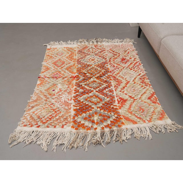 Vintage Hand-Knotted runner rug is a semi-antique vintage area rug. The '70s Eastern region of Anatolia's unique rug is...