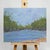 Transform your space with this serene nature-inspired acrylic painting. The view has the blue sky and lovely trees in the...