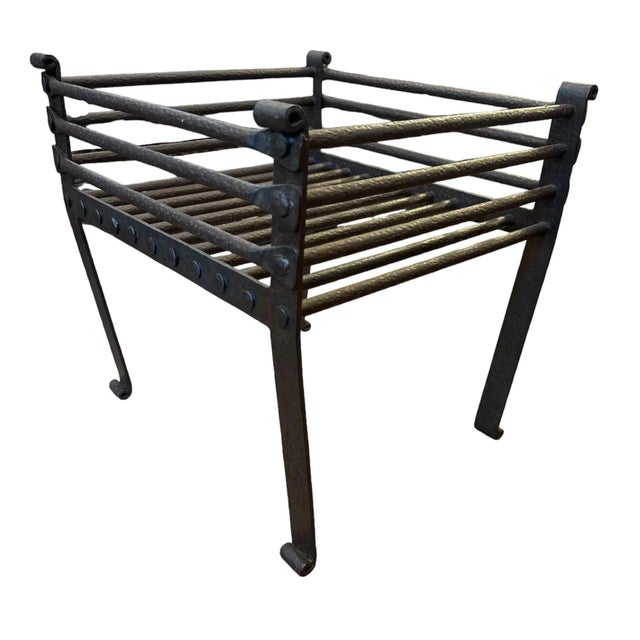 Charming Santa Barbara-style iron fireplace grate with a hammered texture. Solid hand-forged heavy-weight iron grate with...