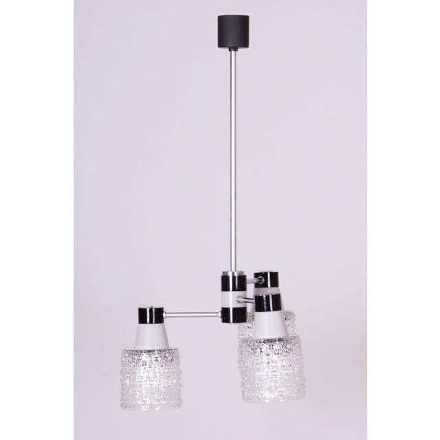 Maker: drukov this three-arm chandelier, produced by the drukov cooperative in brno, is a prime example of czechoslovak...