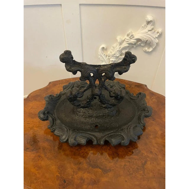 Antique Victorian ornate cast iron doorstop foot scraper having an ornate cast iron base with scraper to the centre. In...