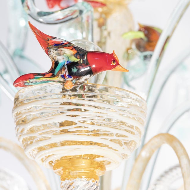 Artistic chandelier with colorful Murano glass birds. A work that shows how Venetian glass art can create original works....
